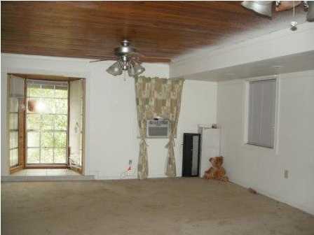 4858 Hinote Road DeFuniak Springs, FL 32433 - Photo 7 of 27 an empty room with windows and closet