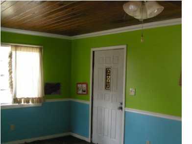 4858 Hinote Road DeFuniak Springs, FL 32433 - Photo 10 of 27 a room with a window and a wooden door