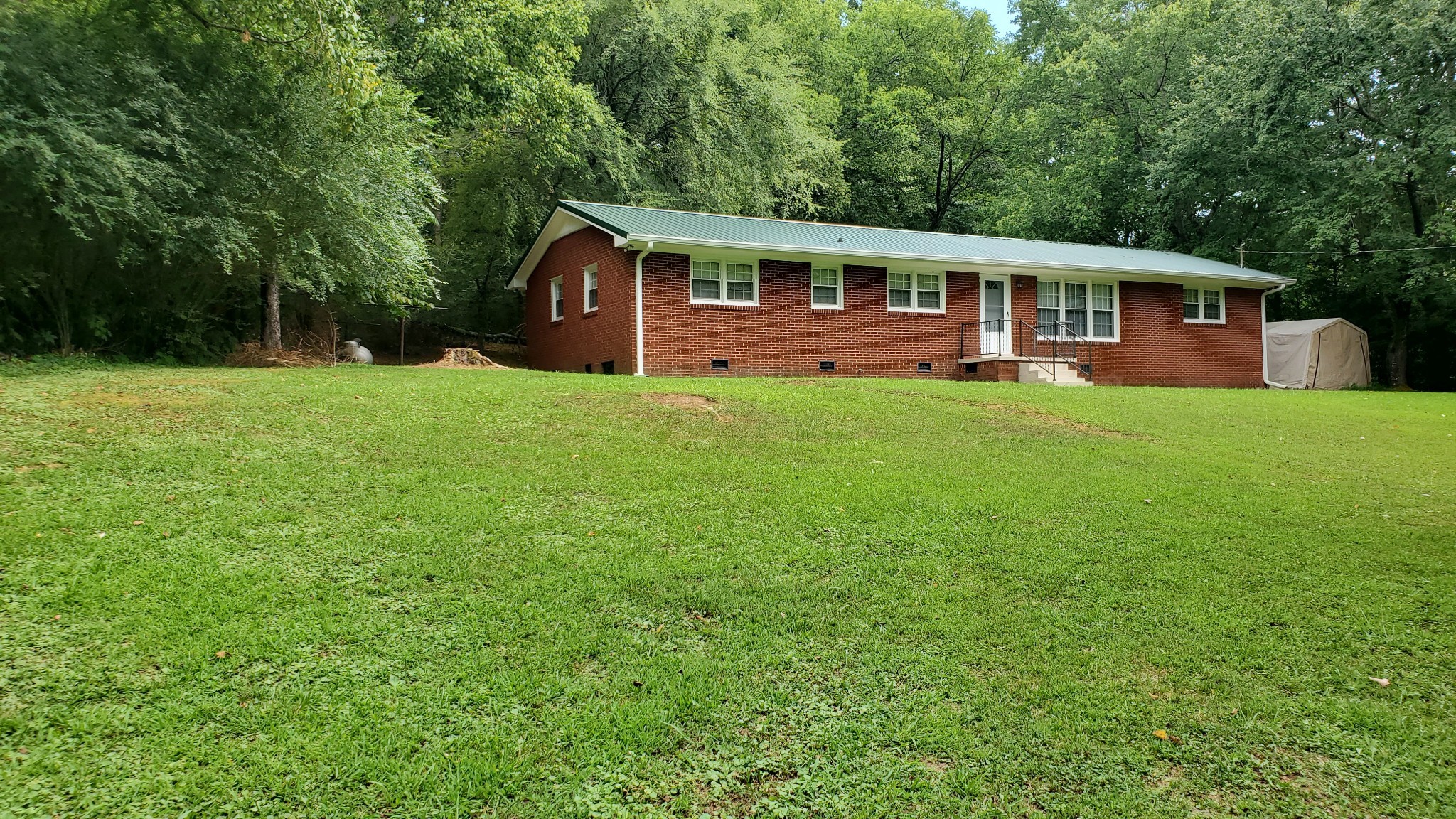 103 Waterloo Road Lawrenceburg, TN 38464 - Photo 1 of 21 a view of a house with backyard and garden