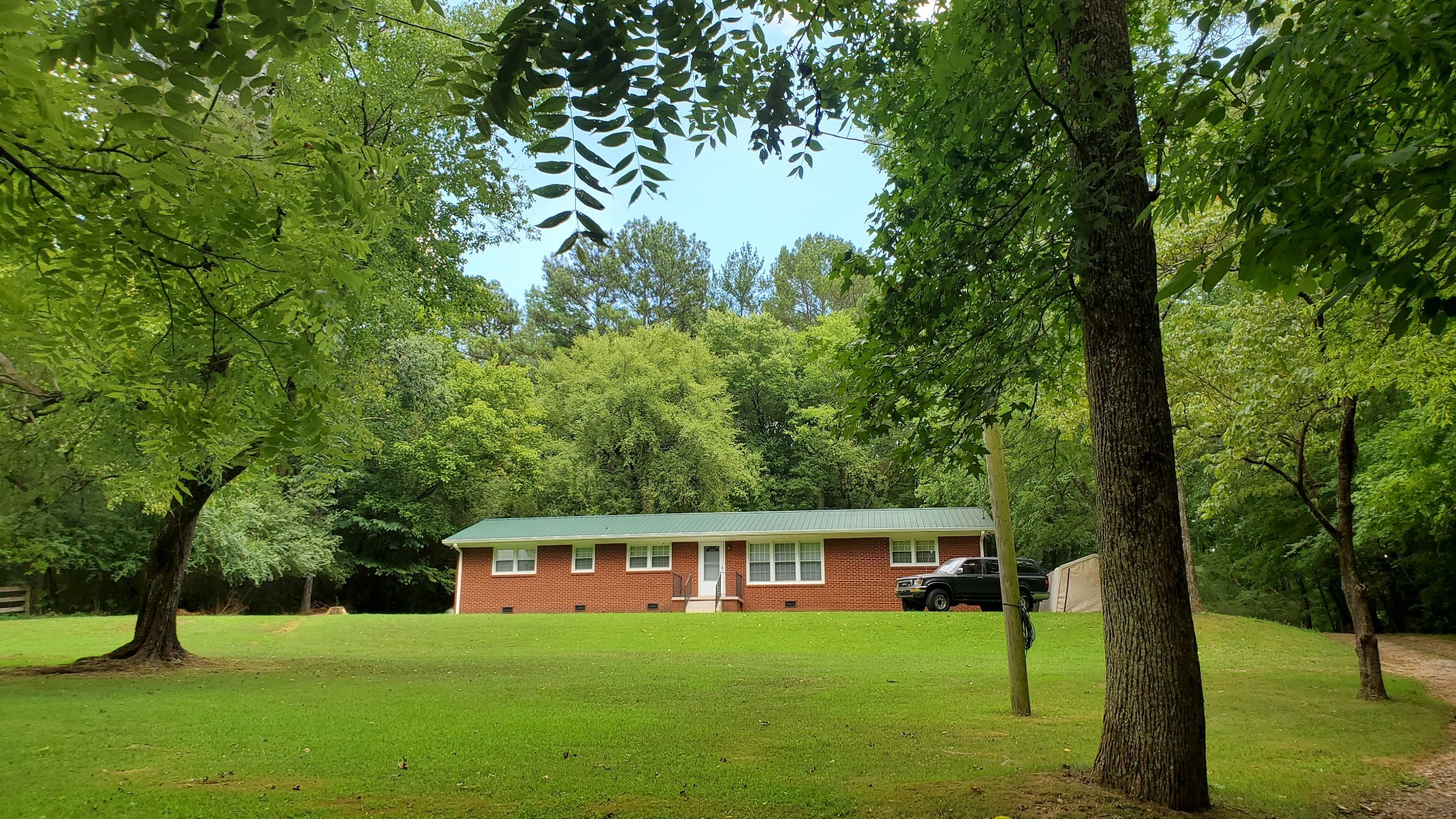 103 Waterloo Road Lawrenceburg, TN 38464 - Photo 13 of 21 a house view with a sitting space and garden