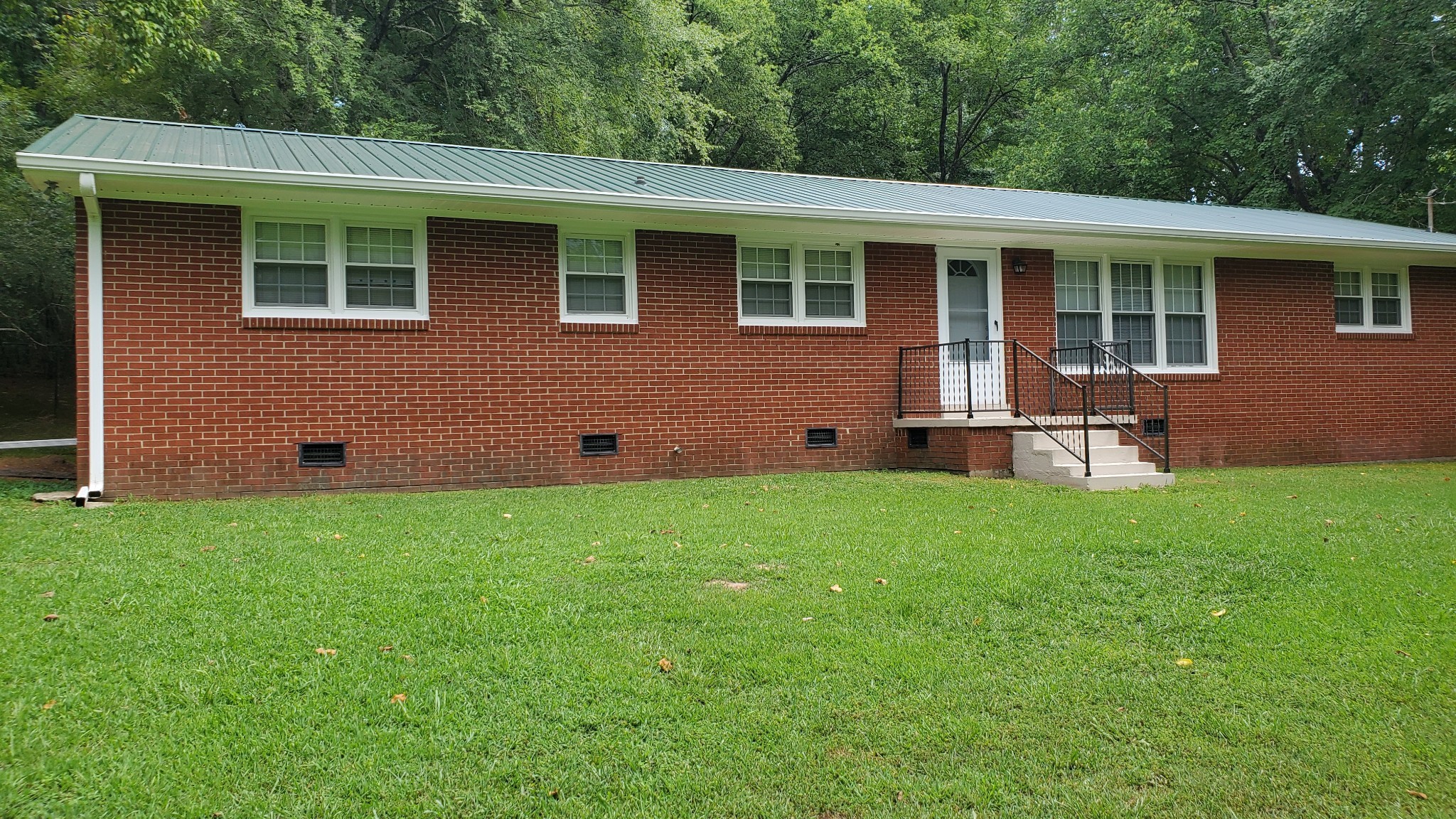 103 Waterloo Road Lawrenceburg, TN 38464 - Photo 14 of 21 a front view of a house with a garden