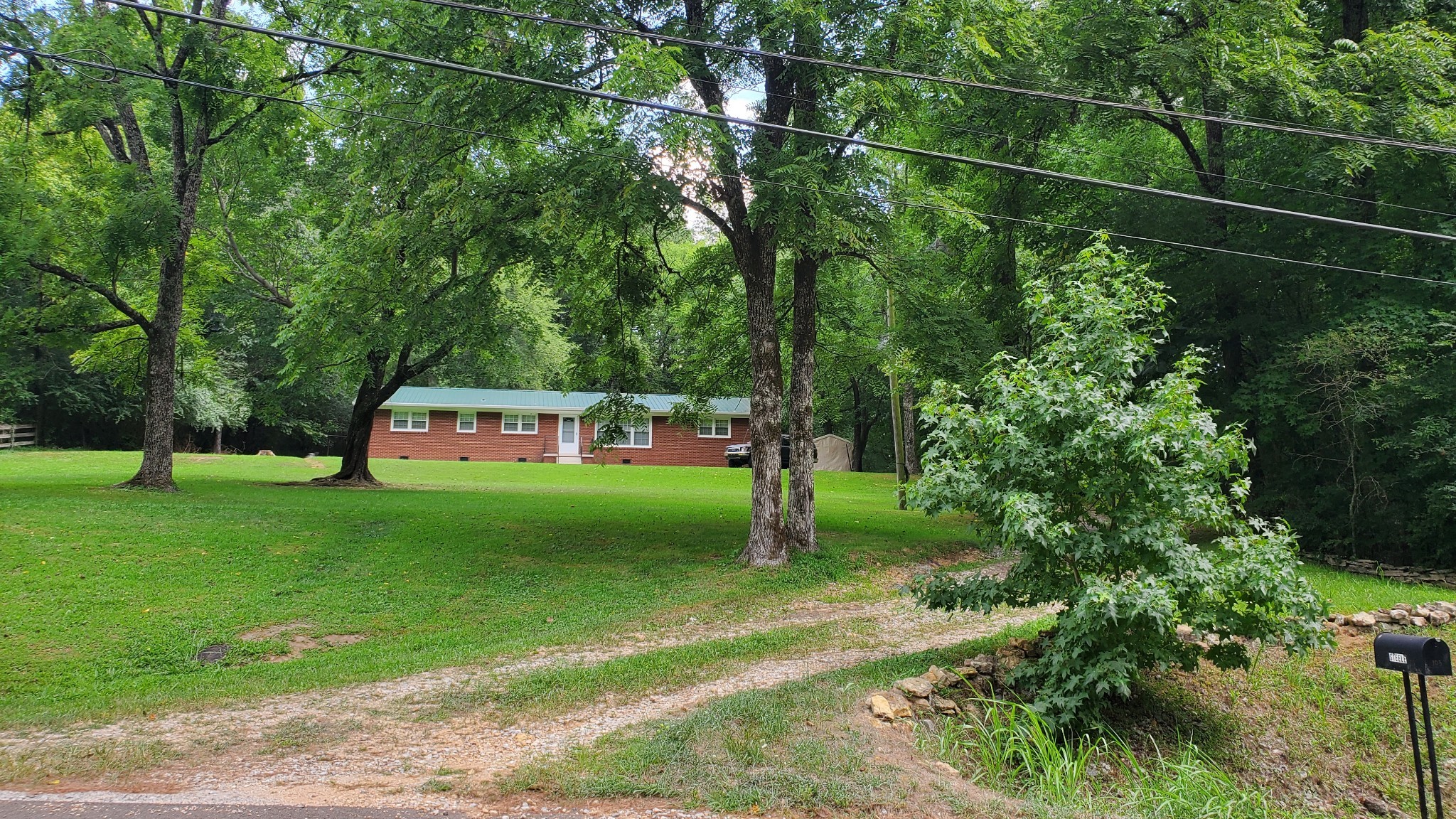 103 Waterloo Road Lawrenceburg, TN 38464 - Photo 16 of 21 a green field with lots of trees