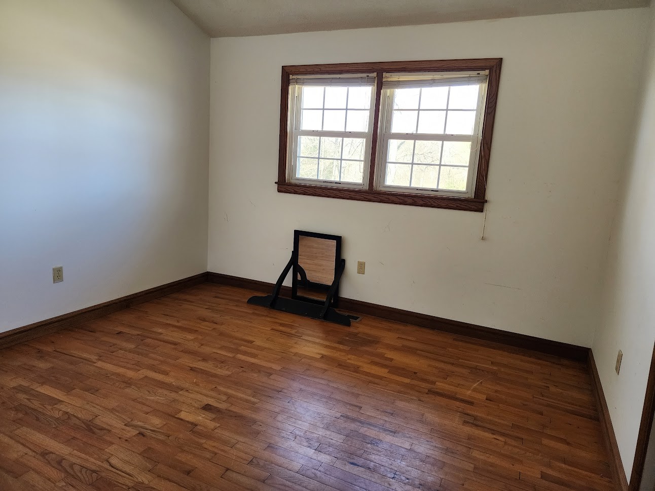 103 Waterloo Road Lawrenceburg, TN 38464 - Photo 8 of 21 a view of an empty room with wooden floor and a window
