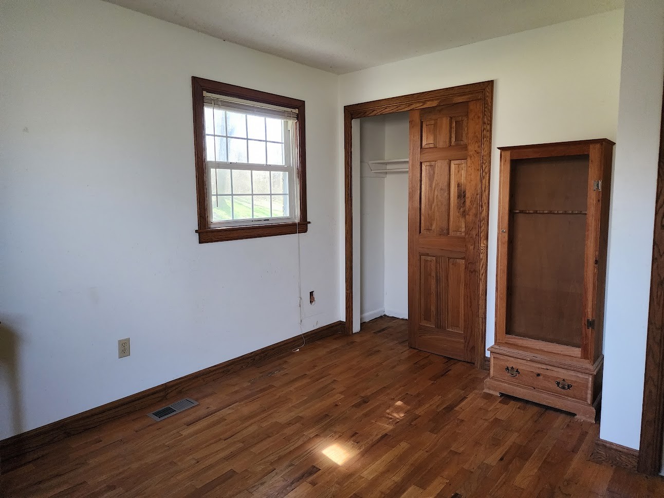 103 Waterloo Road Lawrenceburg, TN 38464 - Photo 9 of 21 an empty room with wooden floor closet and windows
