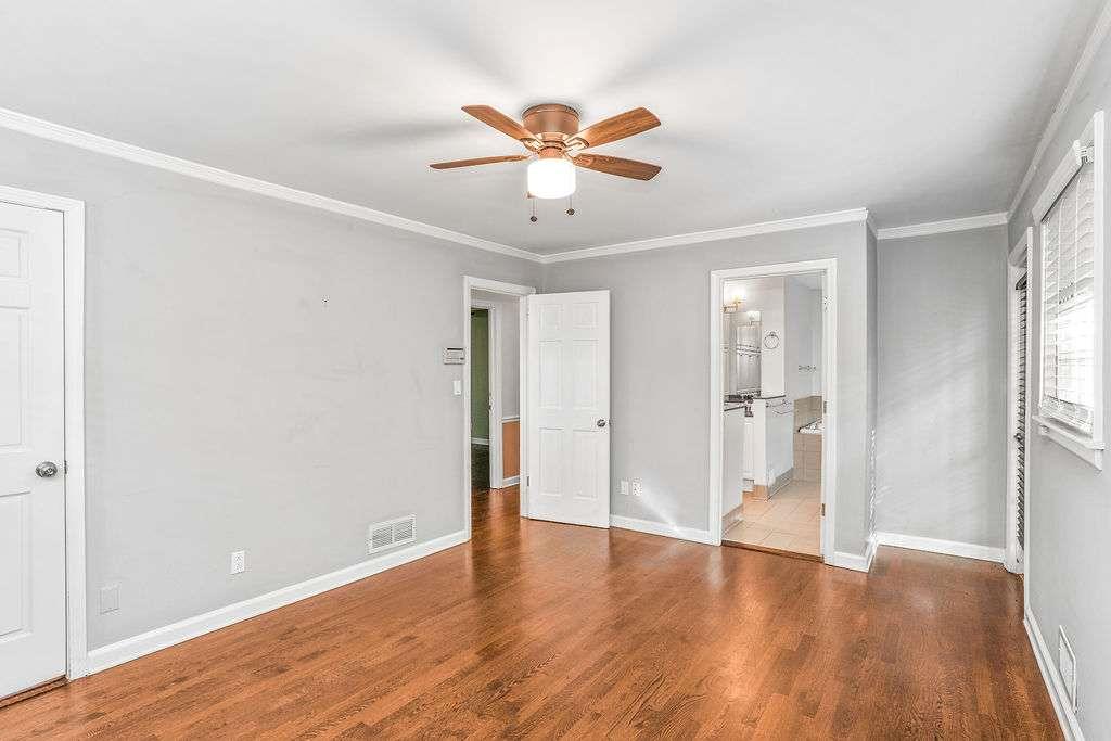 3911 Ivy Road Northeast Atlanta, GA 30342 - Photo 16 of 28 a view of an empty room with wooden floor