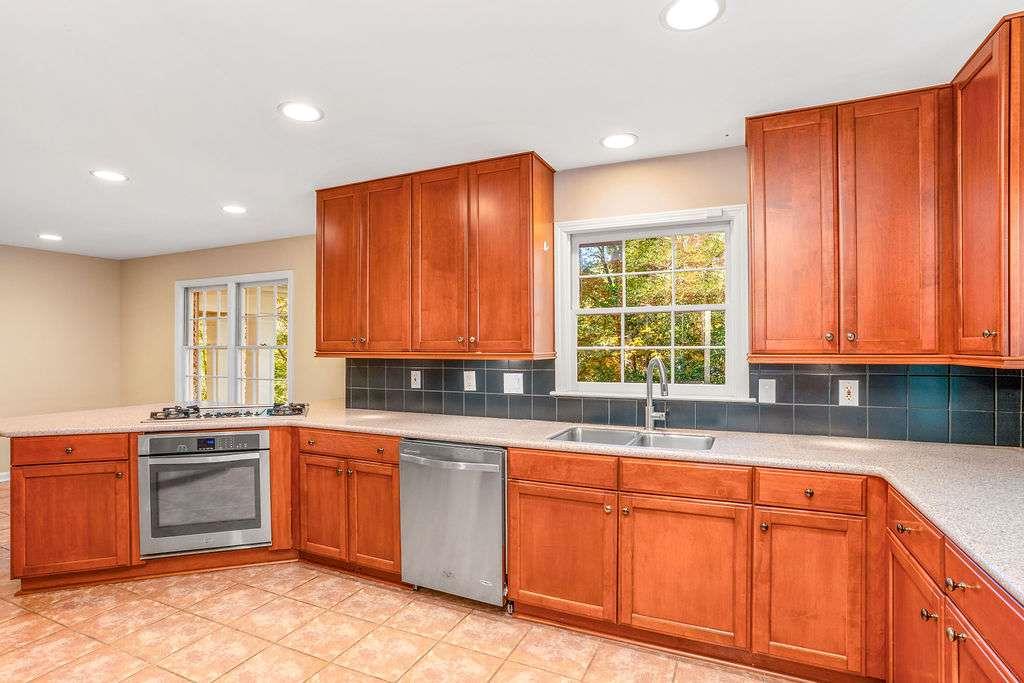3911 Ivy Road Northeast Atlanta, GA 30342 - Photo 5 of 28 a kitchen that has a sink and a stove in it