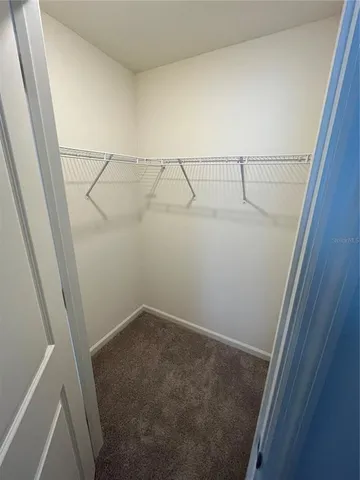 a view of storage and utility room with racks on wall