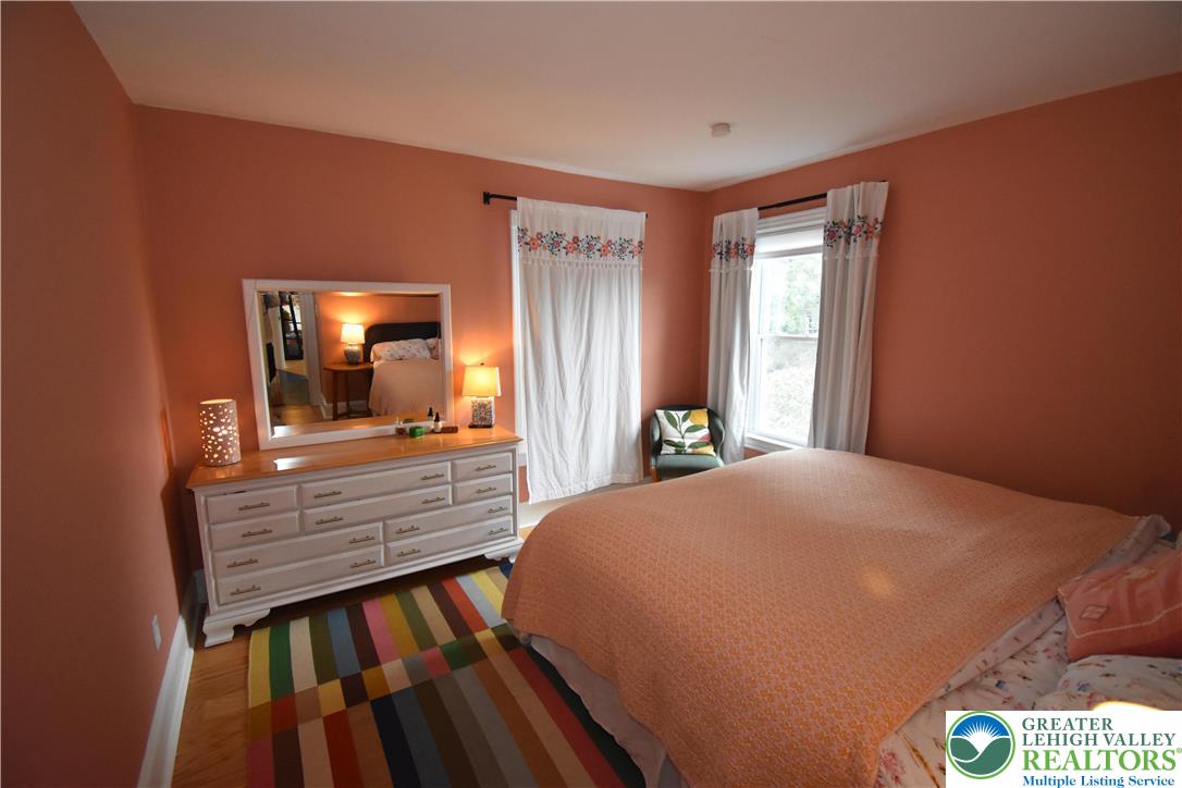 715 Coleman Street Easton, PA 18042 - Photo 21 of 38 a bedroom with a bed and wooden floor