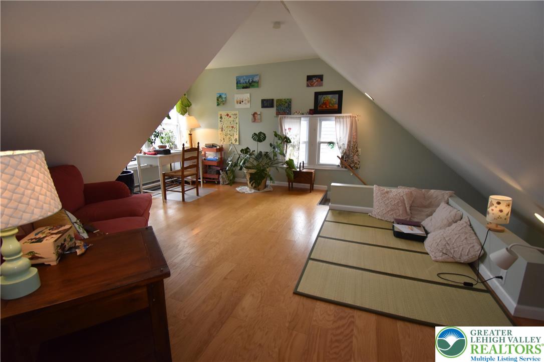 715 Coleman Street Easton, PA 18042 - Photo 27 of 38 a living room with furniture and a chandelier