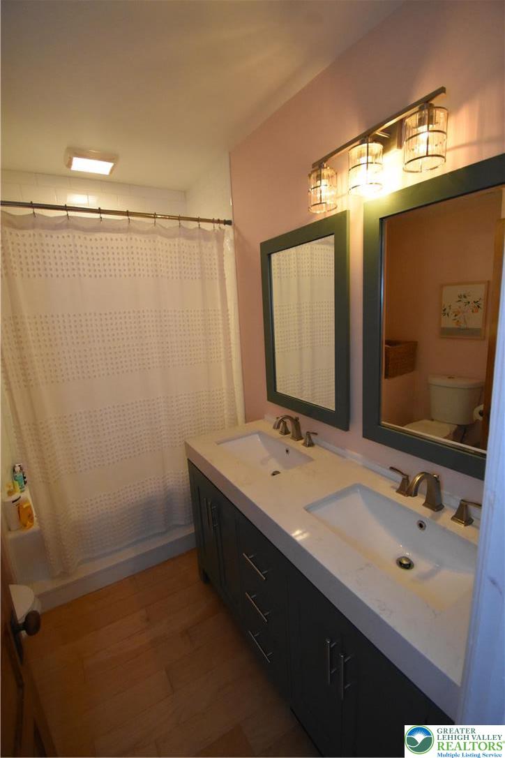 715 Coleman Street Easton, PA 18042 - Photo 29 of 38 a bathroom with a sink and a mirror