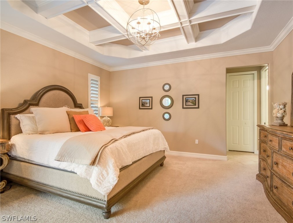 9495 Piacere Way Naples, FL 34113 - Photo 12 of 25 a bedroom with a bed and a dresser