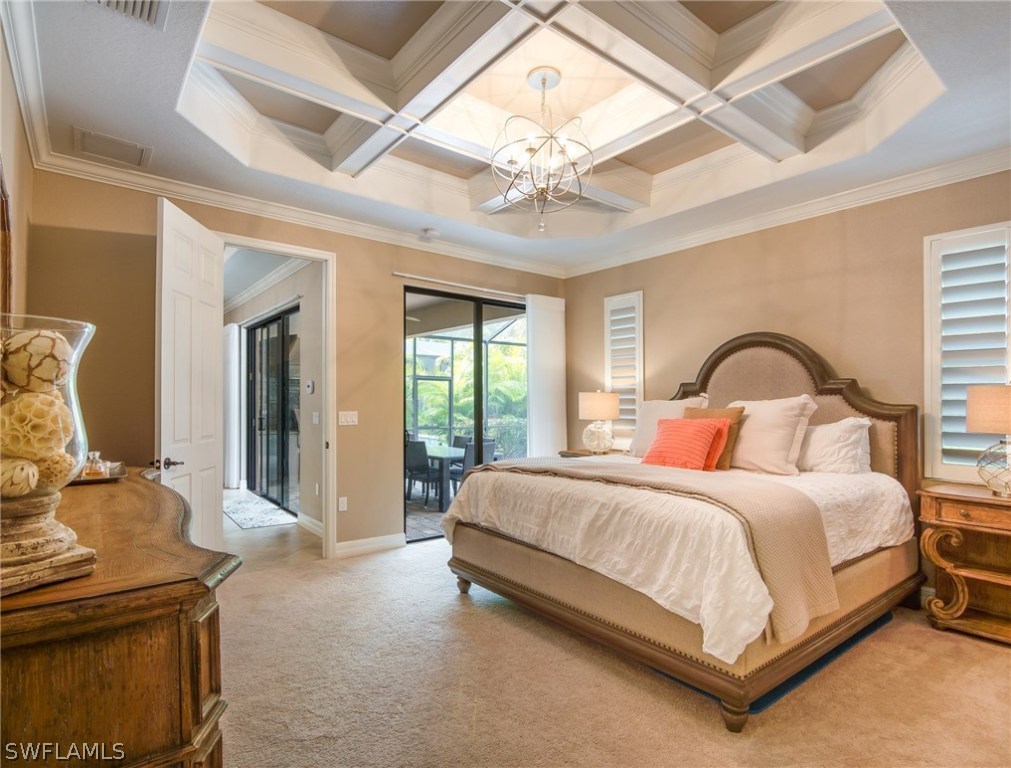 9495 Piacere Way Naples, FL 34113 - Photo 13 of 25 a bedroom with a bed and a gym equipment