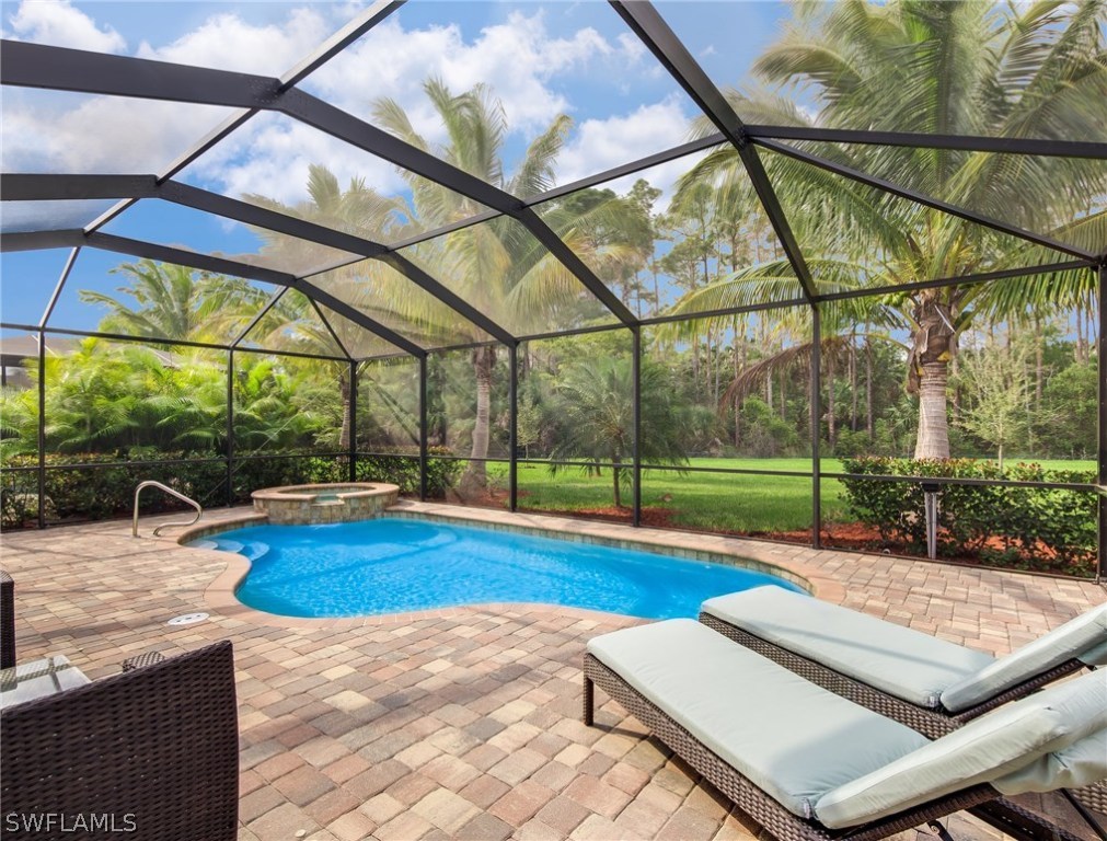 9495 Piacere Way Naples, FL 34113 - Photo 21 of 25 a view of yard with swimming pool