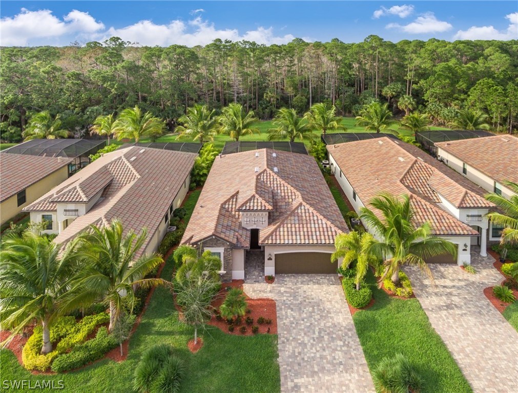 9495 Piacere Way Naples, FL 34113 - Photo 23 of 25 an aerial view of a house with a garden
