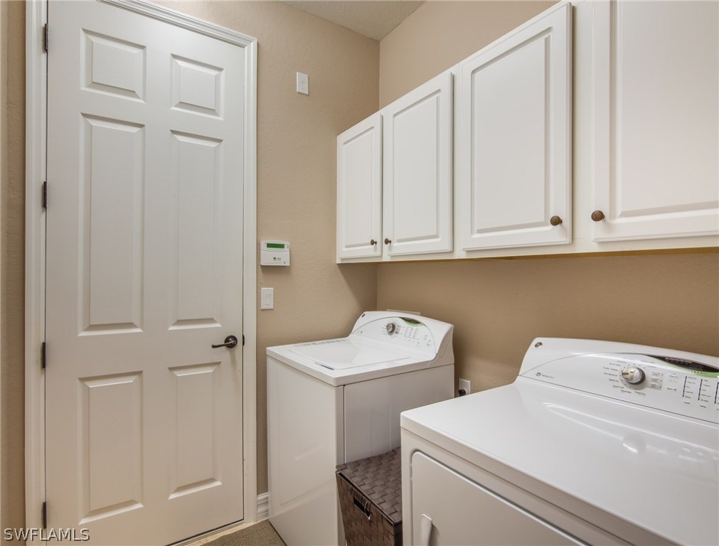 9495 Piacere Way Naples, FL 34113 - Photo 25 of 25 a utility room with dryer and washer