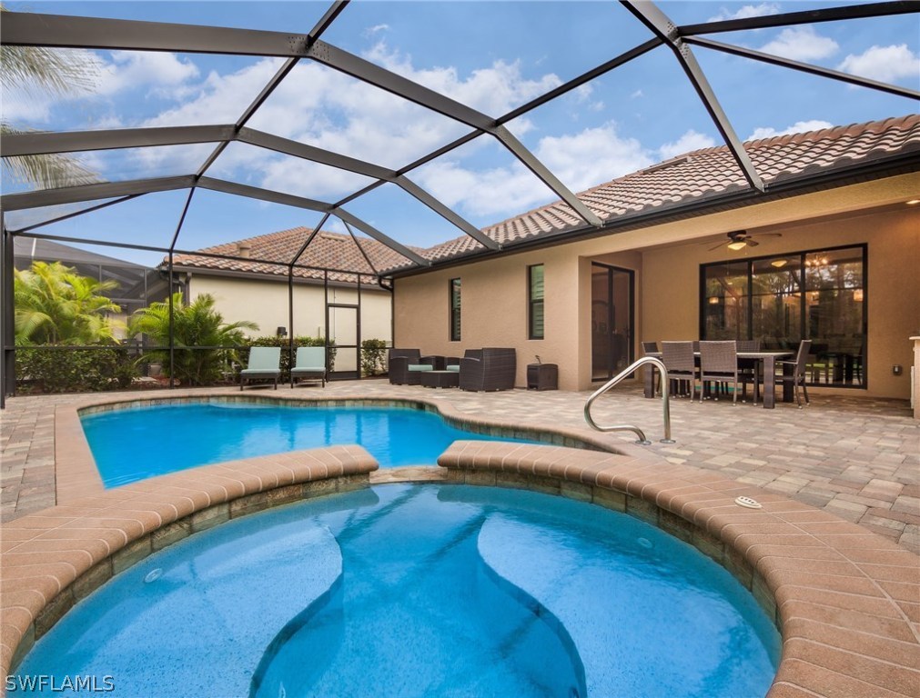 9495 Piacere Way Naples, FL 34113 - Photo 3 of 25 a view of swimming pool with outdoor seating