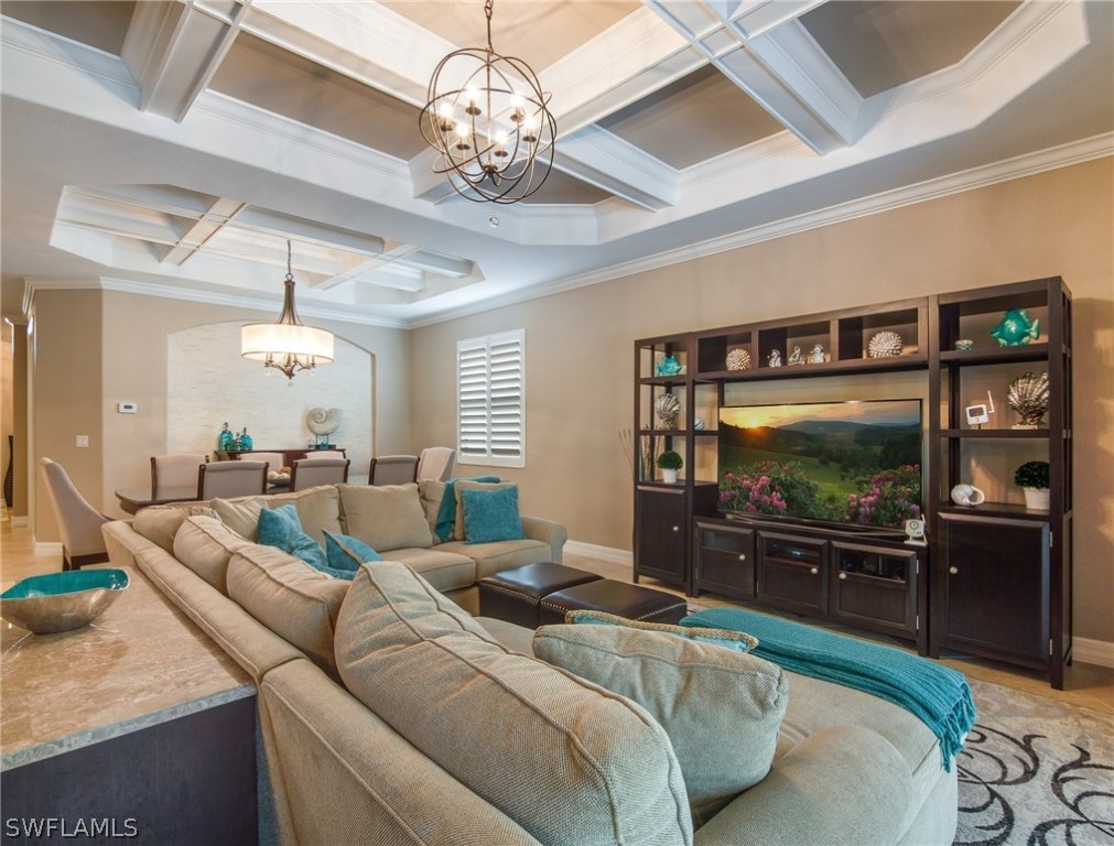 9495 Piacere Way Naples, FL 34113 - Photo 4 of 25 a living room with furniture and a flat screen tv