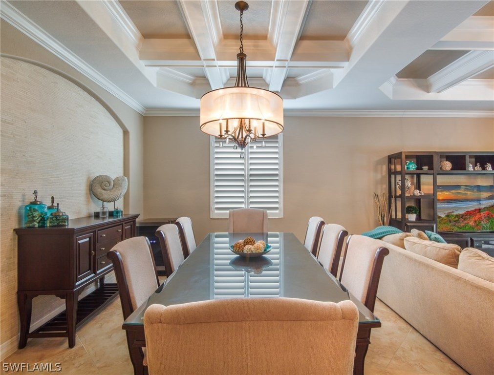 9495 Piacere Way Naples, FL 34113 - Photo 6 of 25 a living room with furniture and a chandelier