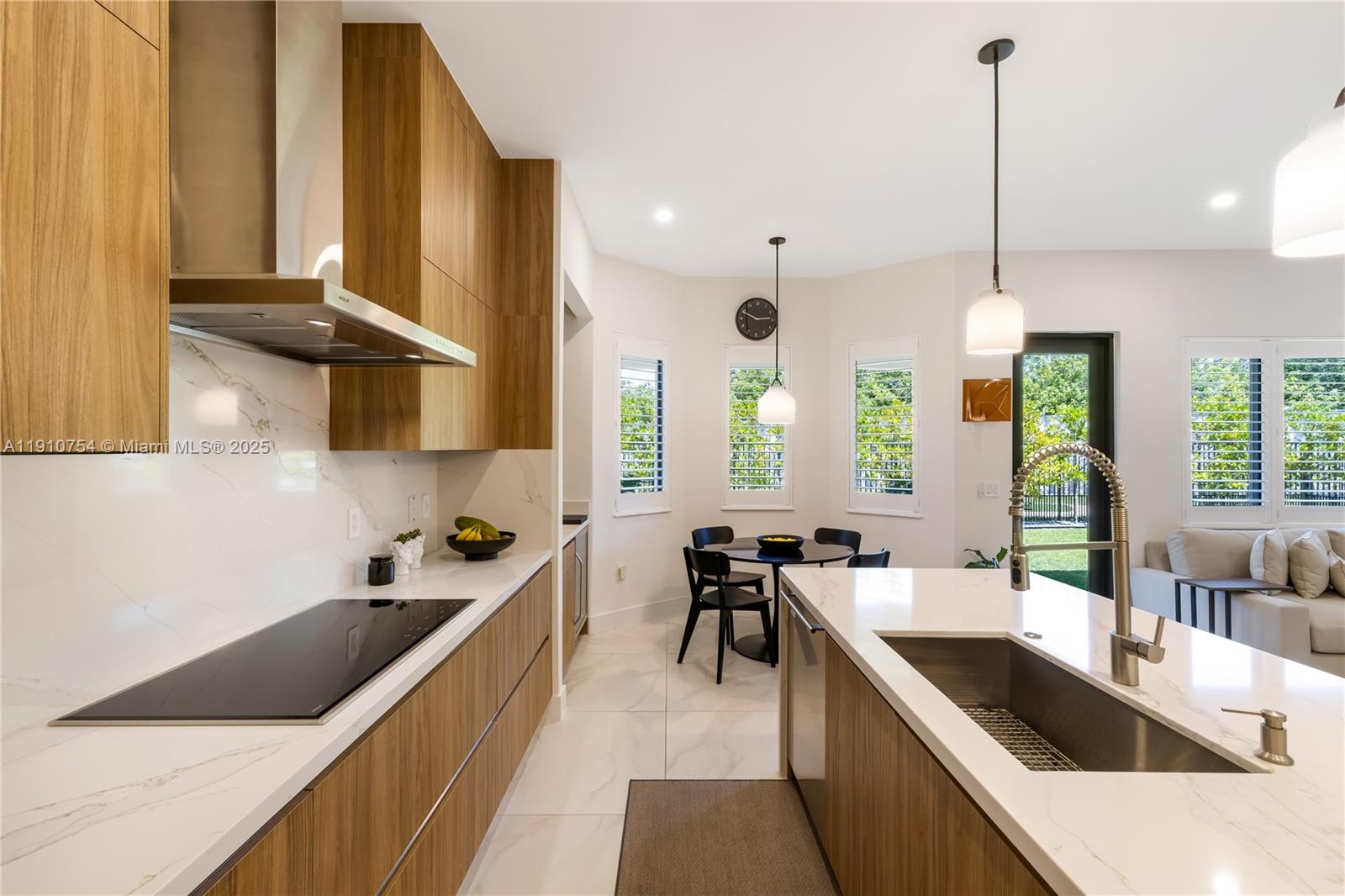 12021 Southwest 82nd Place Miami, FL 33156 - Photo 12 of 44 a kitchen with stainless steel appliances granite countertop sink stove and cabinets