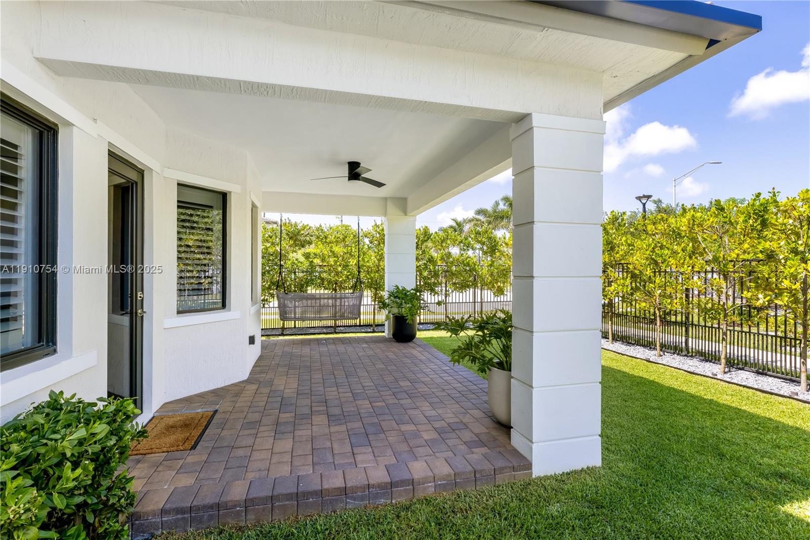 12021 Southwest 82nd Place Miami, FL 33156 - Photo 23 of 44 a front view of a house with a yard
