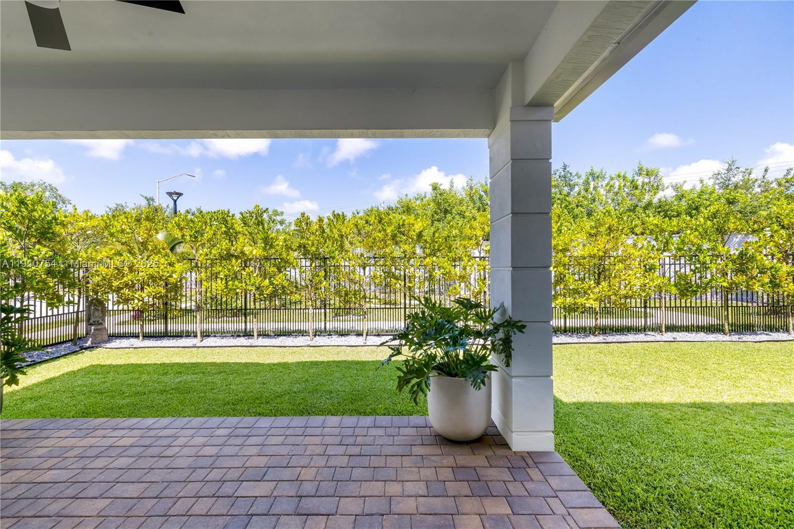 12021 Southwest 82nd Place Miami, FL 33156 - Photo 28 of 44 a view of a fountain in front of a house