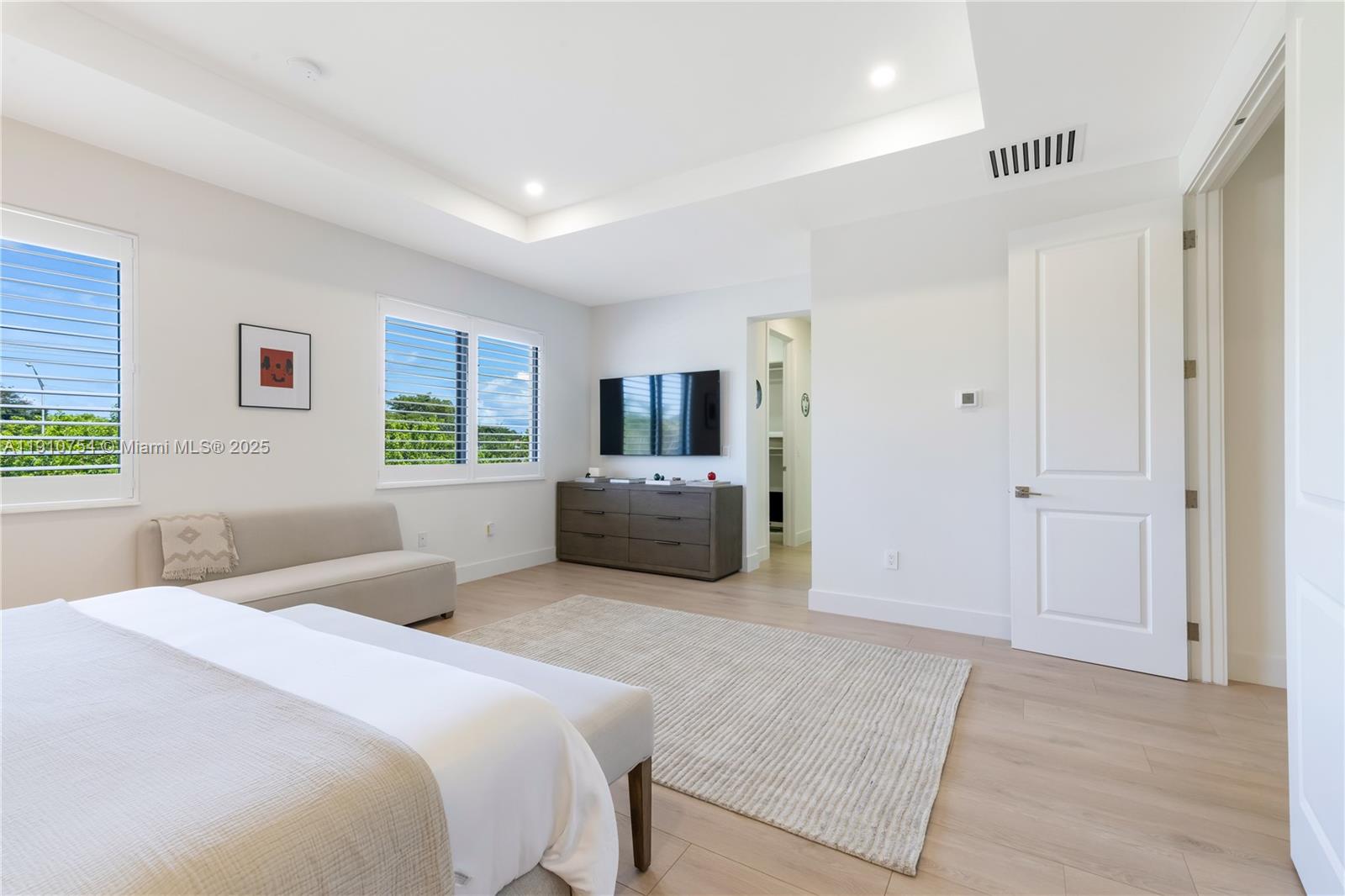 12021 Southwest 82nd Place Miami, FL 33156 - Photo 31 of 44 a bedroom with a bed and a television