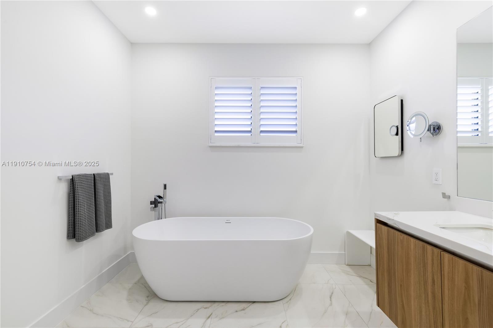 12021 Southwest 82nd Place Miami, FL 33156 - Photo 33 of 44 a bathroom with a bathtub and shower