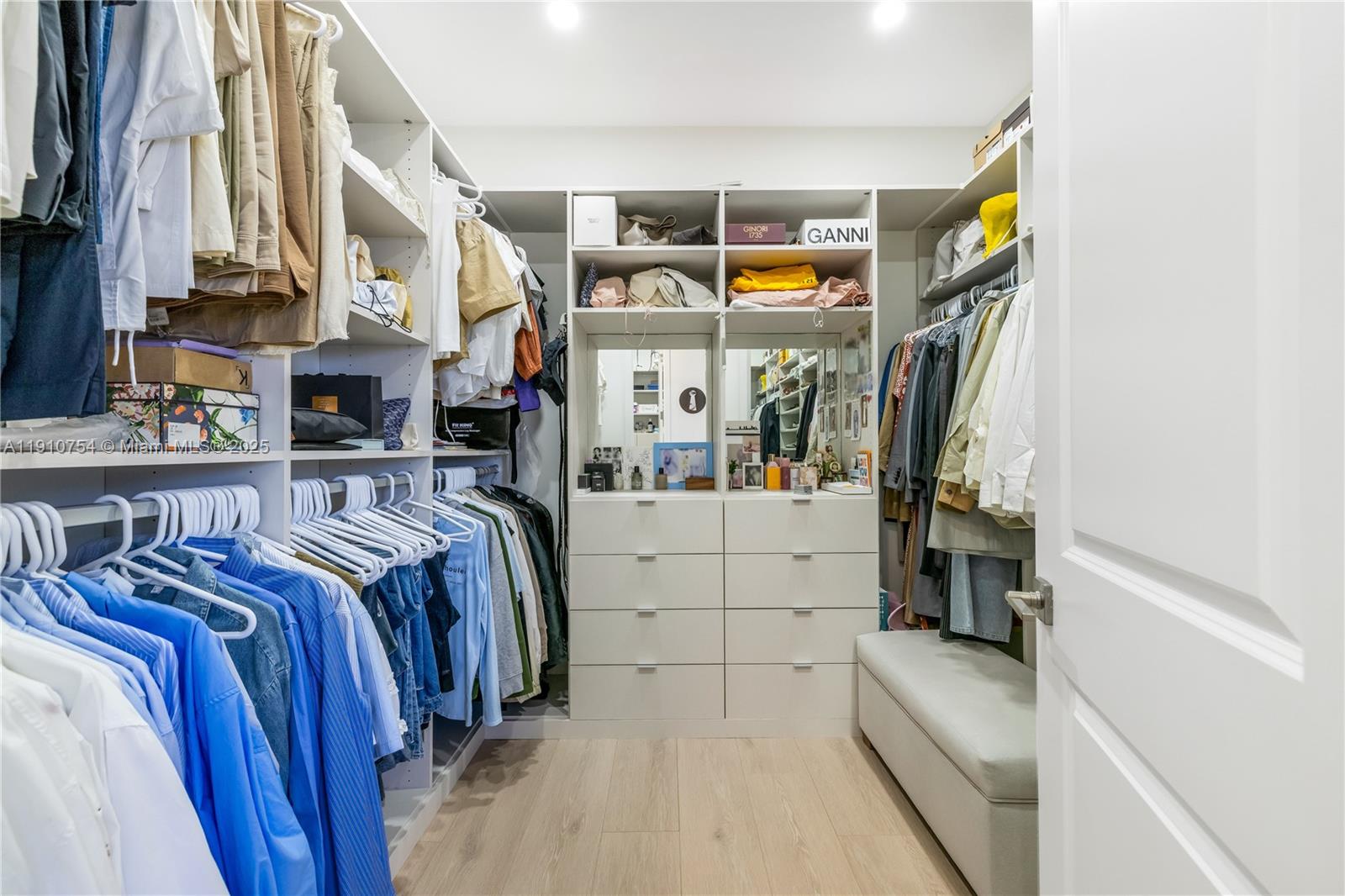 12021 Southwest 82nd Place Miami, FL 33156 - Photo 34 of 44 a view of walk in closet with clothes and shoes