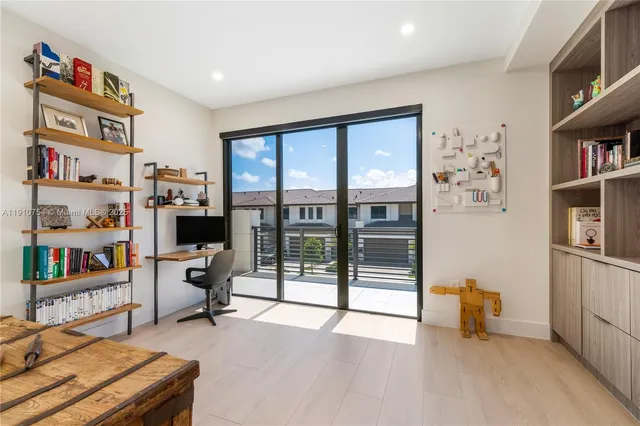 a bedroom with two beds and a window