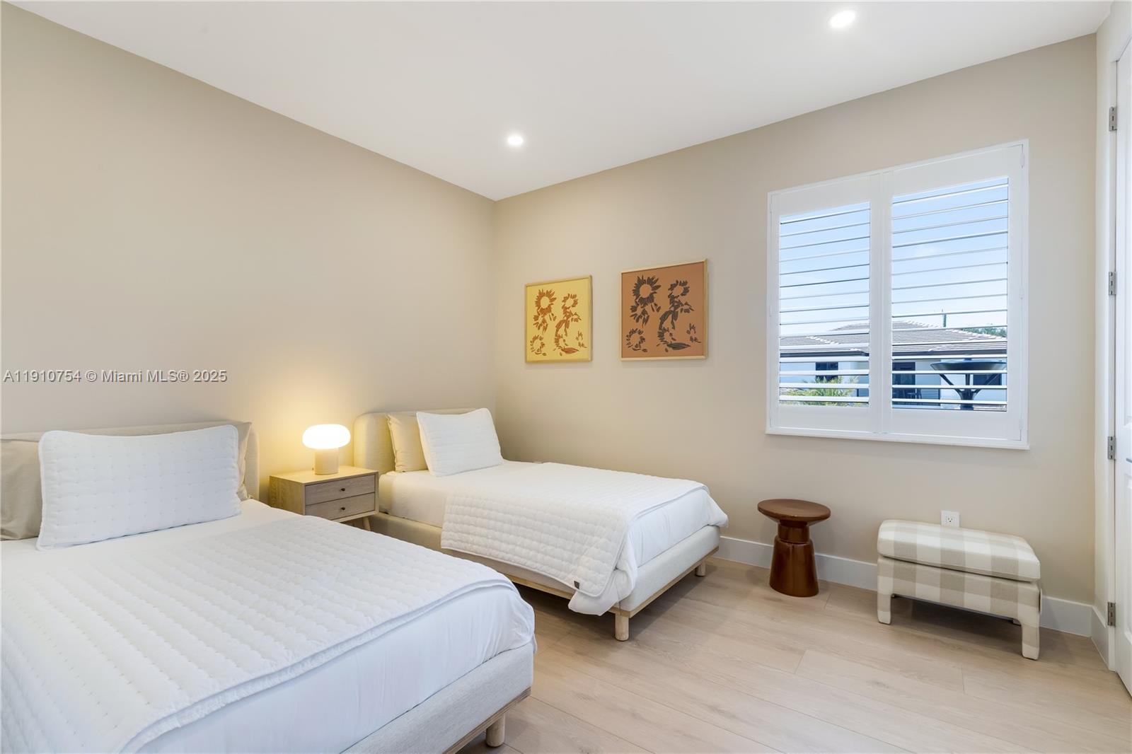 12021 Southwest 82nd Place Miami, FL 33156 - Photo 39 of 44 a bedroom with two beds and a window