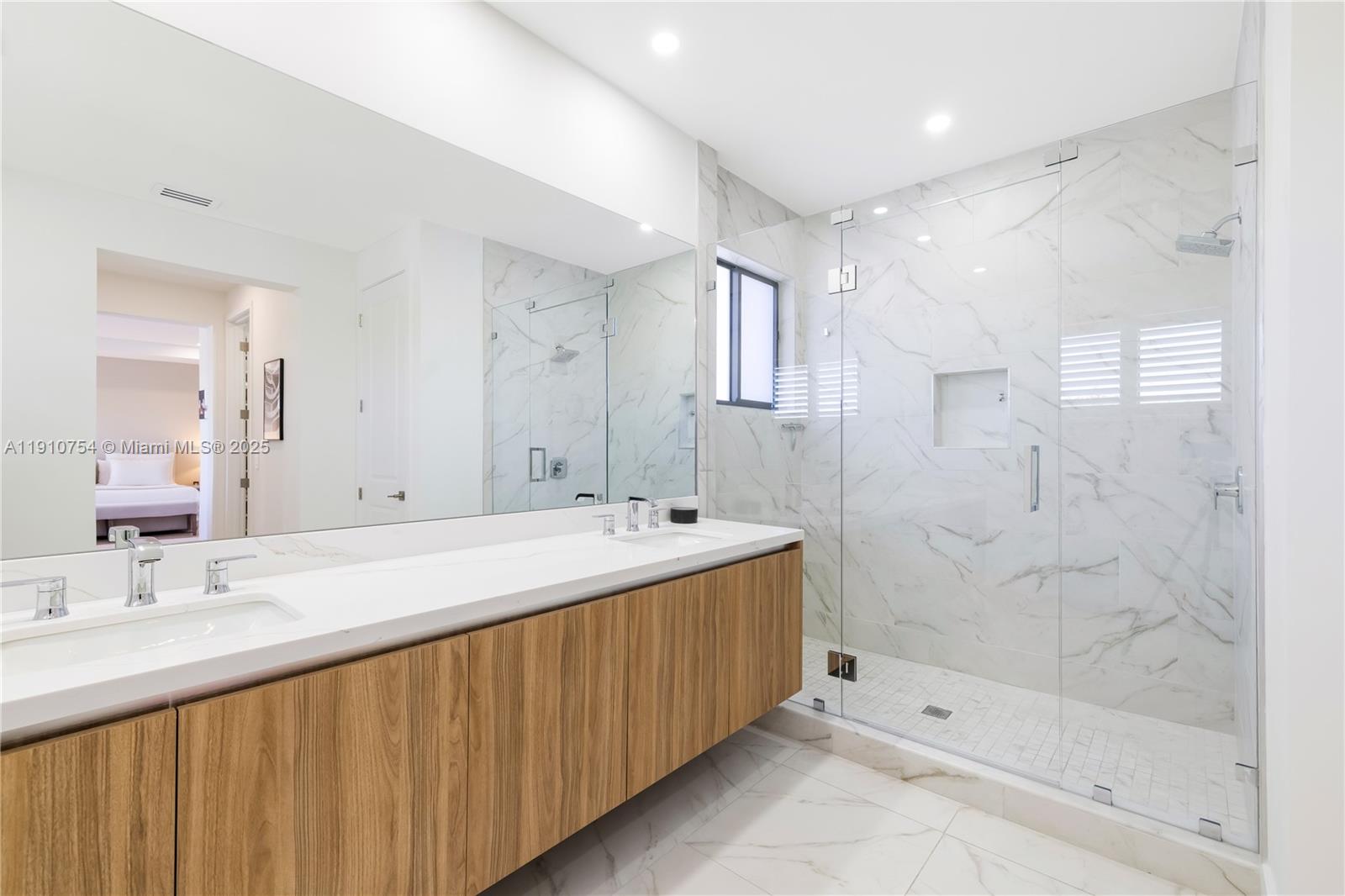 12021 Southwest 82nd Place Miami, FL 33156 - Photo 41 of 44 a bathroom with a sink mirror and a bathtub