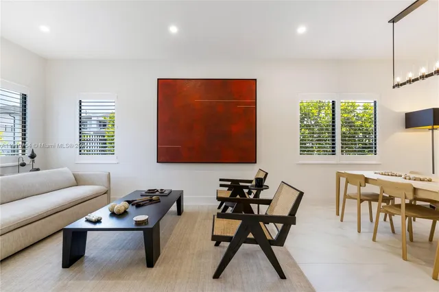 a work room with furniture and windows