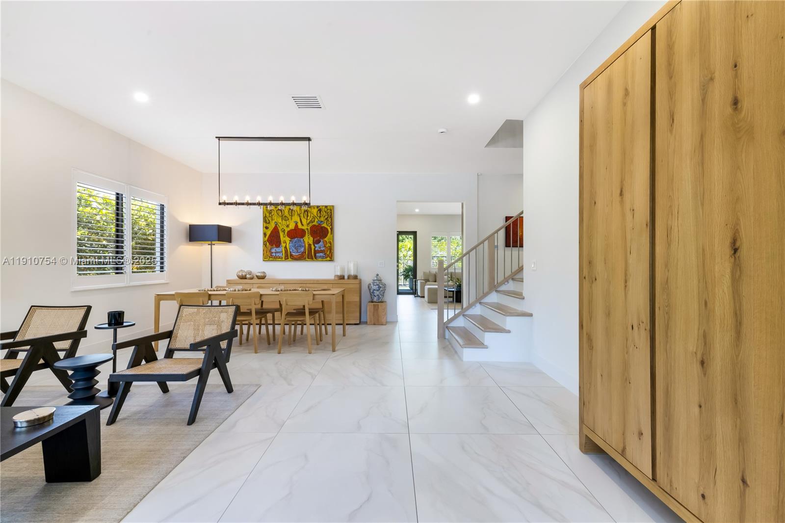 12021 Southwest 82nd Place Miami, FL 33156 - Photo 6 of 44 a living room with furniture and wooden floor