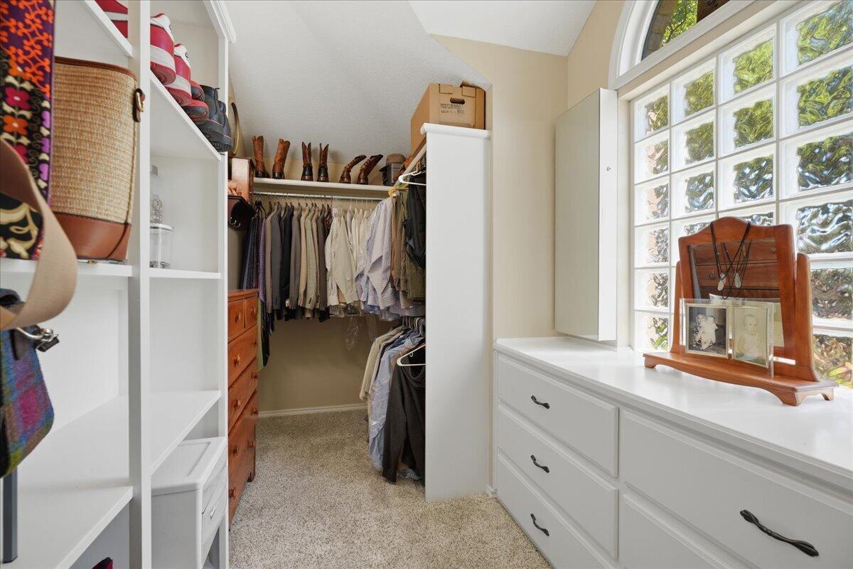 4612 100th Street Lubbock, TX 79424 - Photo 34 of 55 a view of walk in closet with clothes and shoes