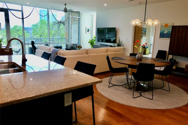a view of a dining room with furniture window and outside view