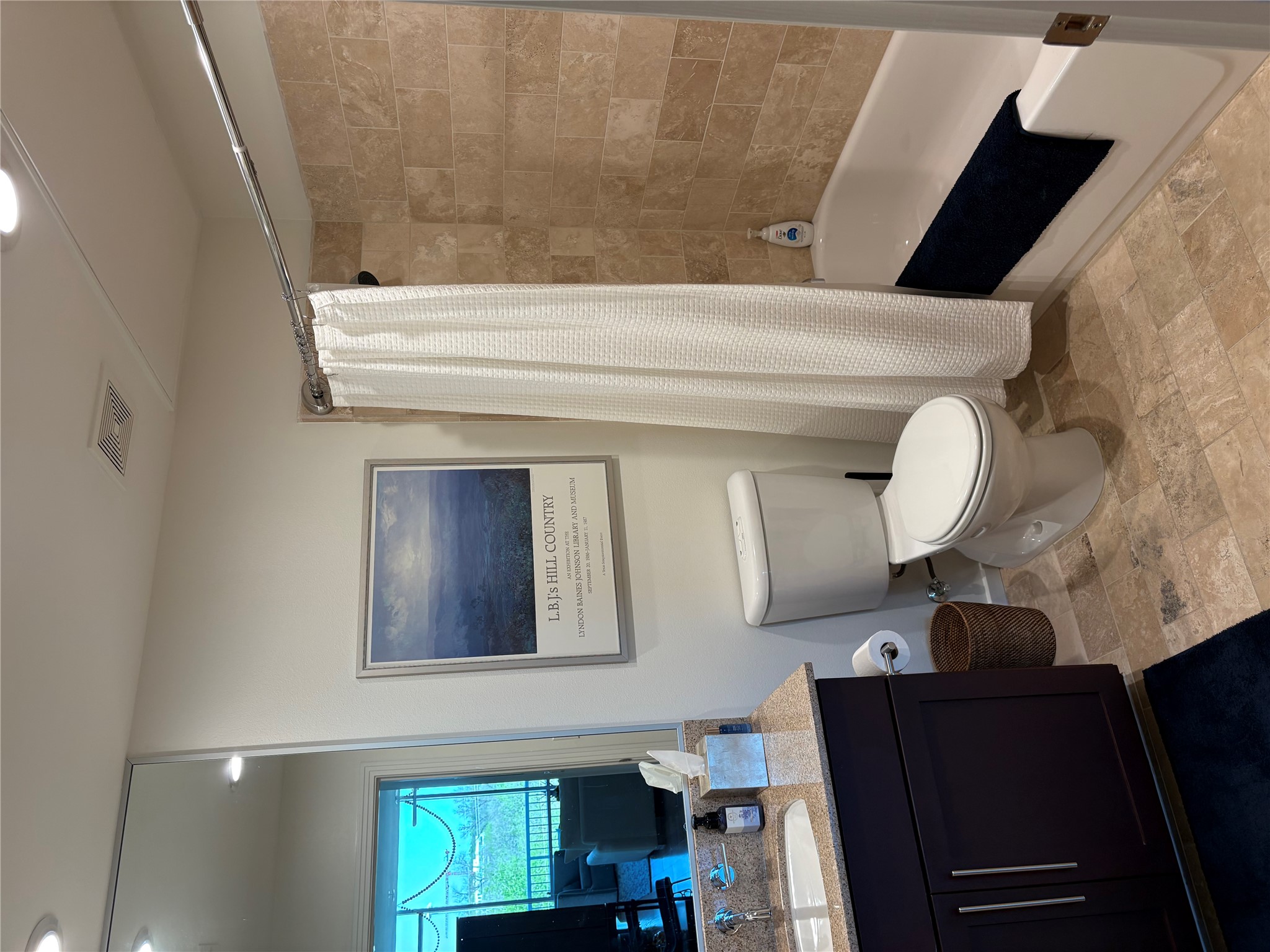 1600 Barton Springs Road, Unit 1301 Austin, TX 78704 - Photo 14 of 27 a bathroom with a toilet a sink and bathtub