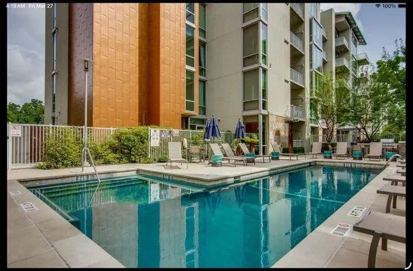 a view of swimming pool from a balcony
