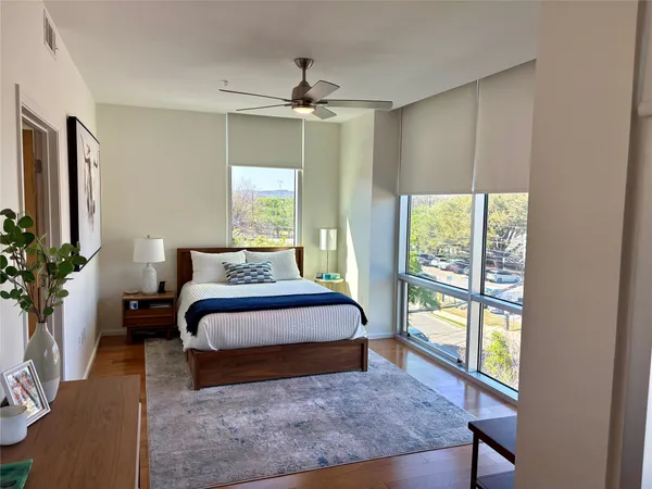 a bedroom with a large bed and a window