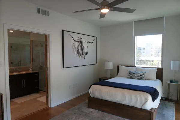 a bedroom with a bed and a window