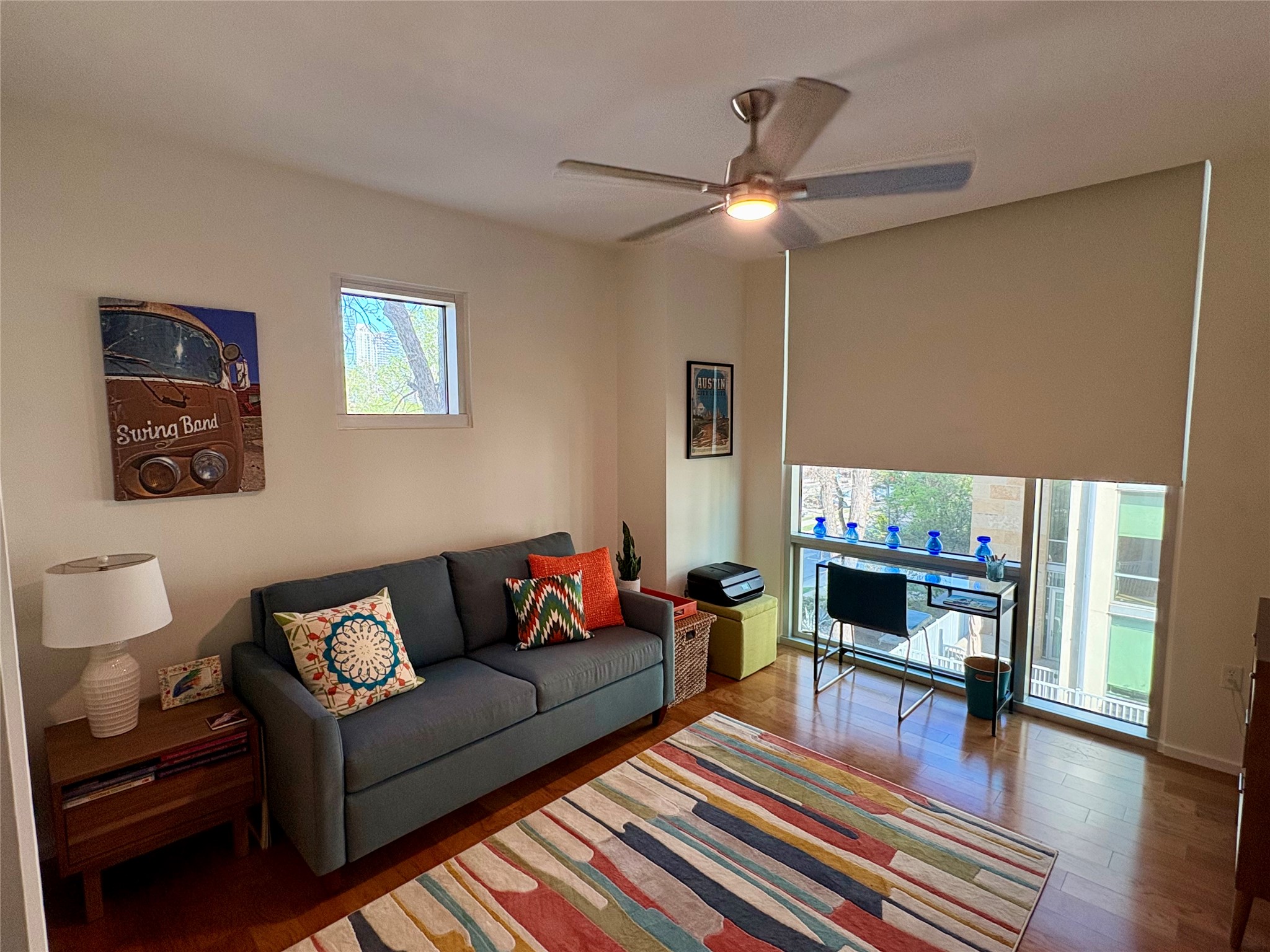 1600 Barton Springs Road, Unit 1301 Austin, TX 78704 - Photo 3 of 27 a living room with furniture and a wooden floor