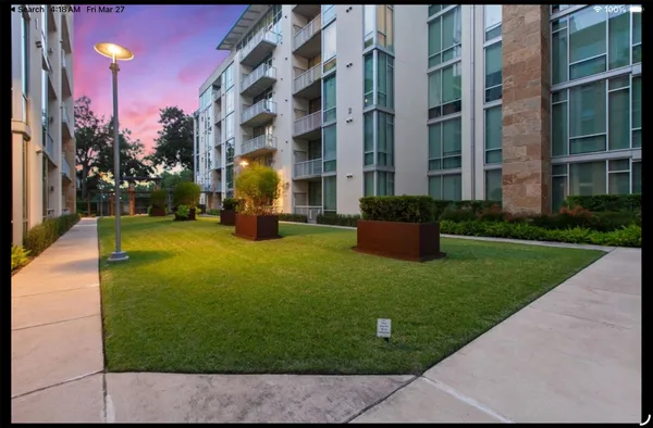 a kitchen with stainless steel appliances granite countertop a stove a sink dishwasher and a dining table