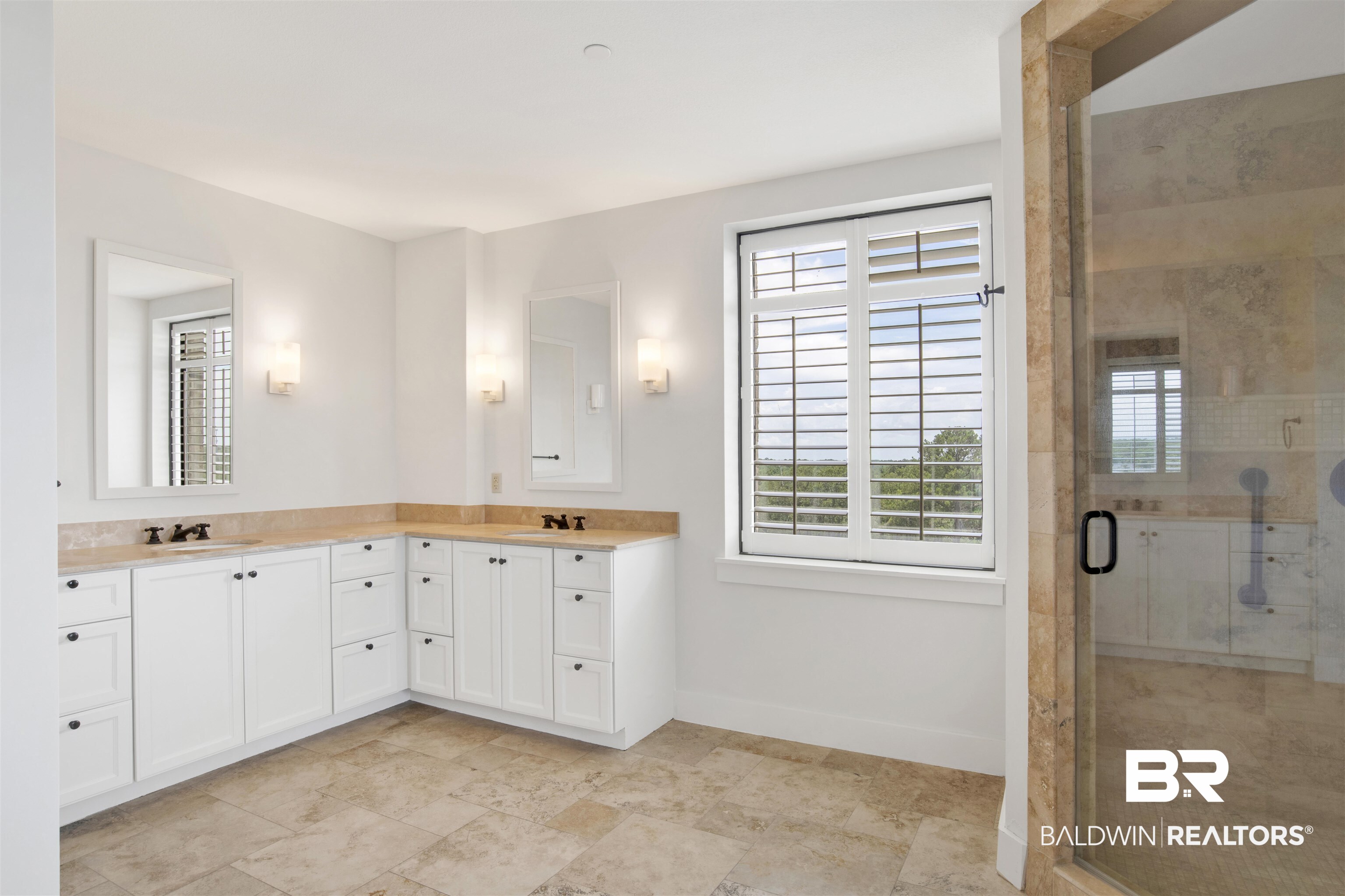18269 Colony Drive, Unit 601 Fairhope, AL 36532 - Photo 6 of 47 Bathroom with double vanity, tile patterned flooring, and a shower with shower door