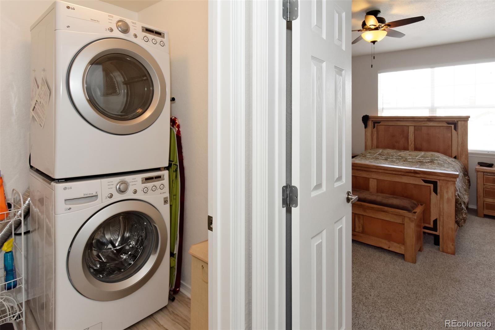8440 Canyon Rim Trail, Unit 4 Parker, CO 80134 - Photo 20 of 28 a view of a hallway with washer and dryer