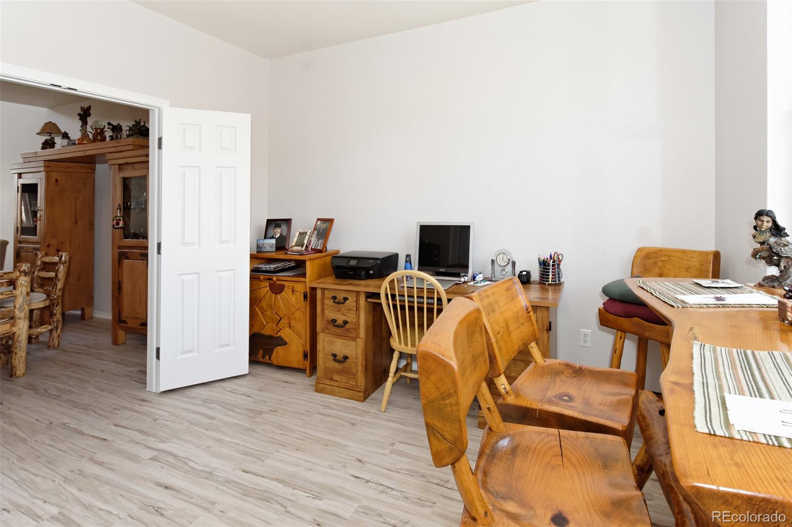 8440 Canyon Rim Trail, Unit 4 Parker, CO 80134 - Photo 21 of 28 a view of kitchen and wooden floor