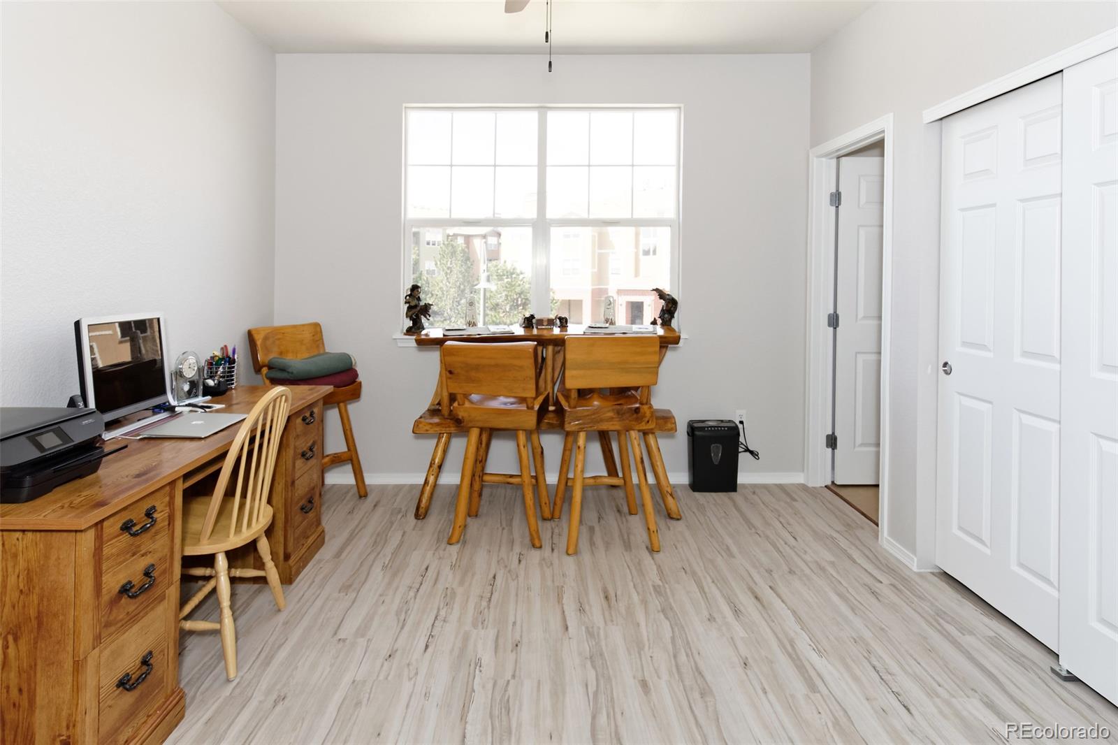 8440 Canyon Rim Trail, Unit 4 Parker, CO 80134 - Photo 22 of 28 a view of a dining room with furniture and wooden floor