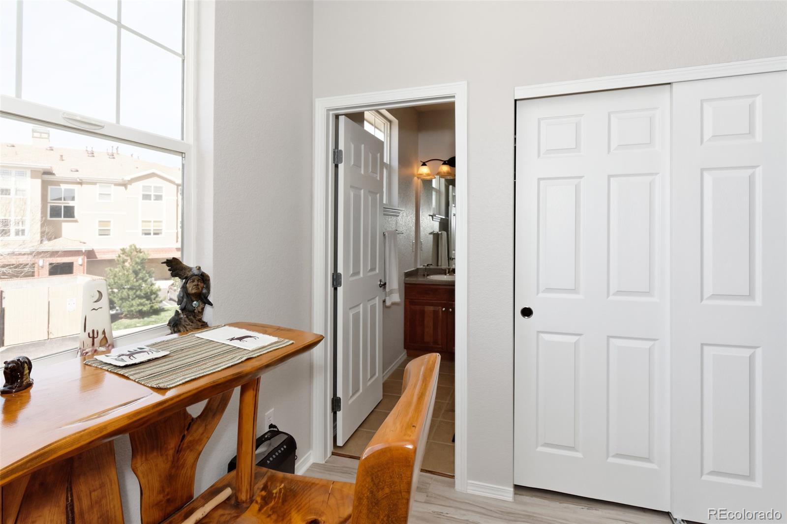 8440 Canyon Rim Trail, Unit 4 Parker, CO 80134 - Photo 23 of 28 a view of a workspace with furniture and a window