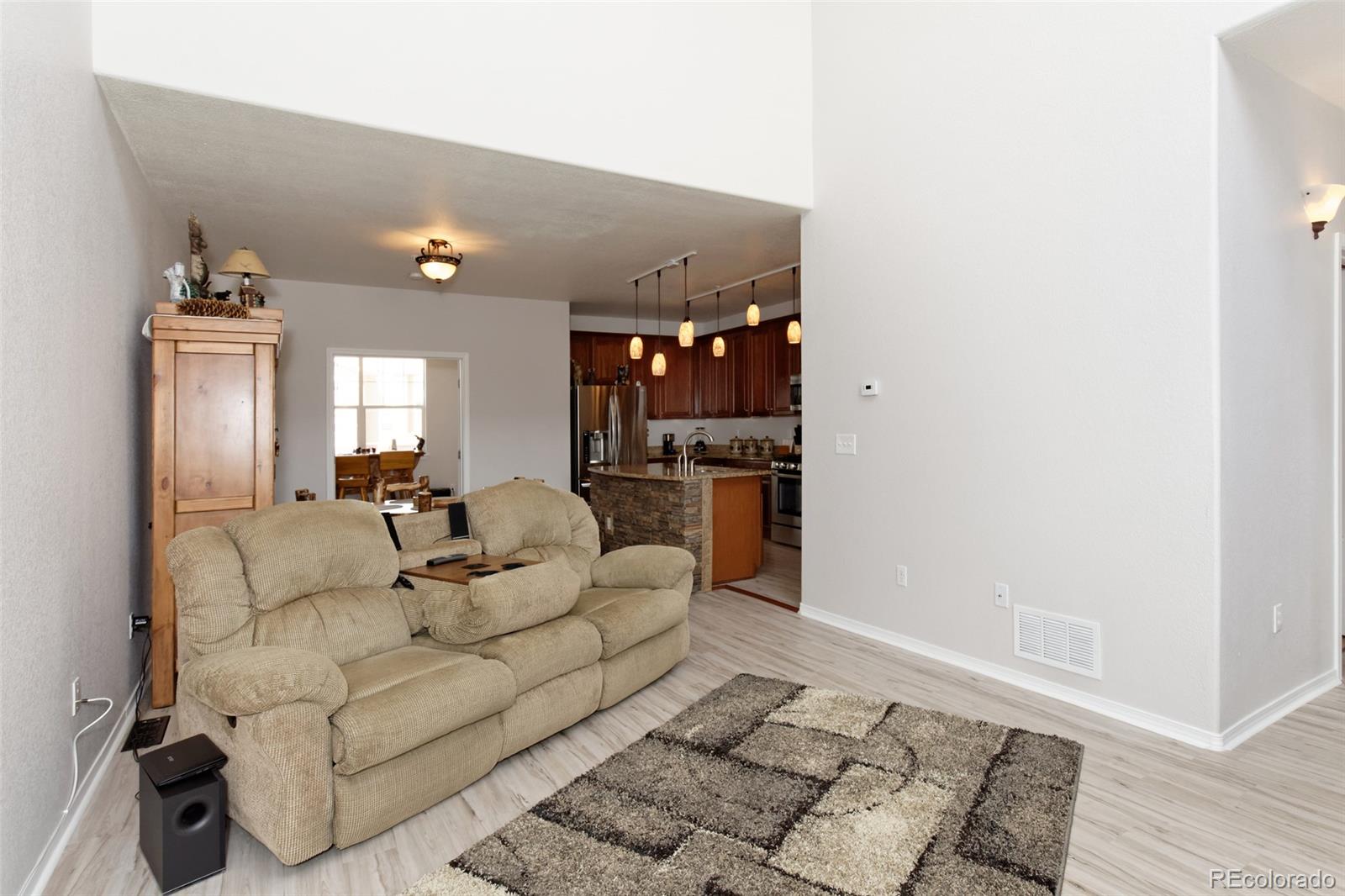 8440 Canyon Rim Trail, Unit 4 Parker, CO 80134 - Photo 7 of 28 a living room with furniture and a rug