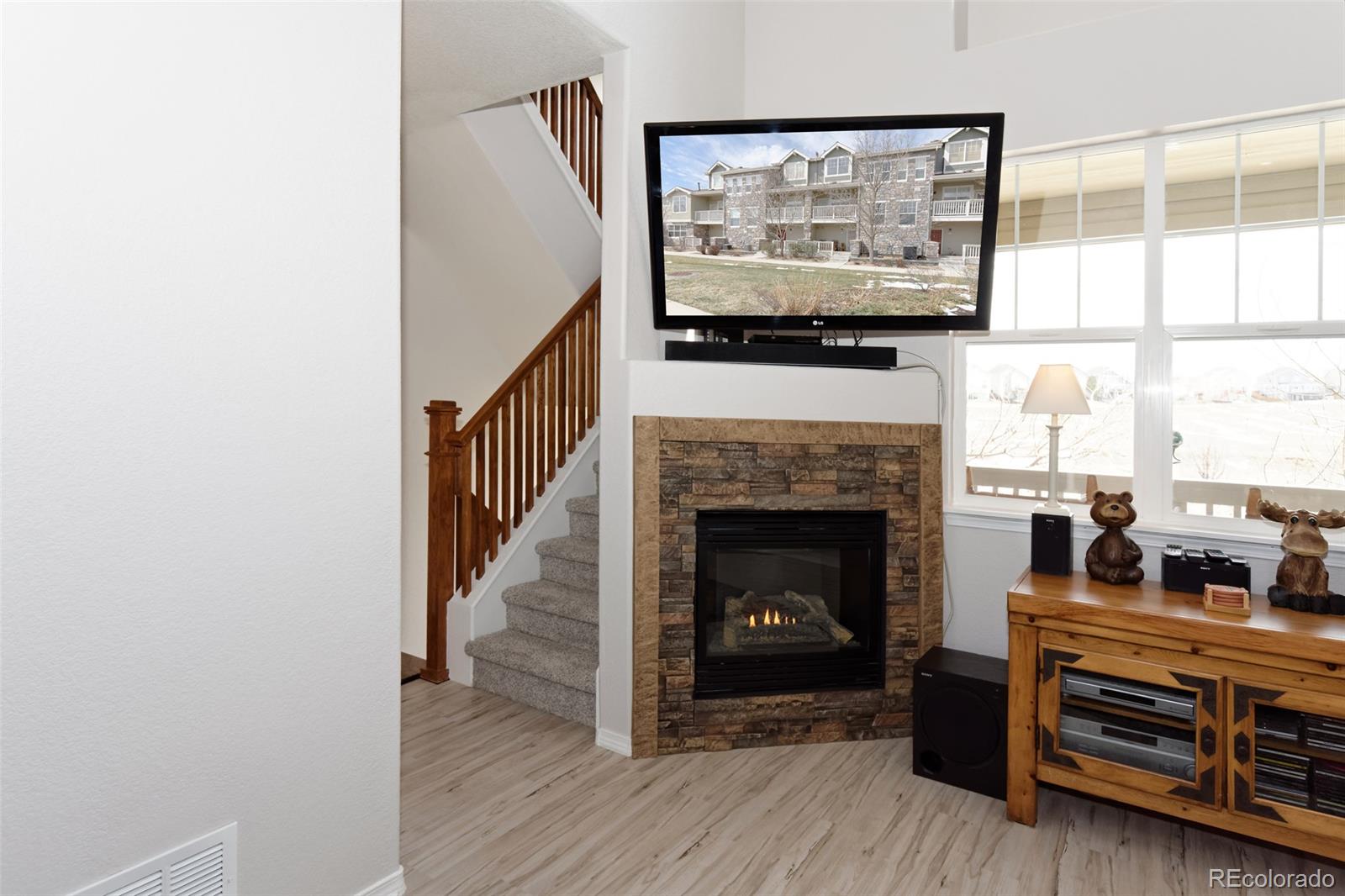 8440 Canyon Rim Trail, Unit 4 Parker, CO 80134 - Photo 9 of 28 a living room with furniture and a fireplace