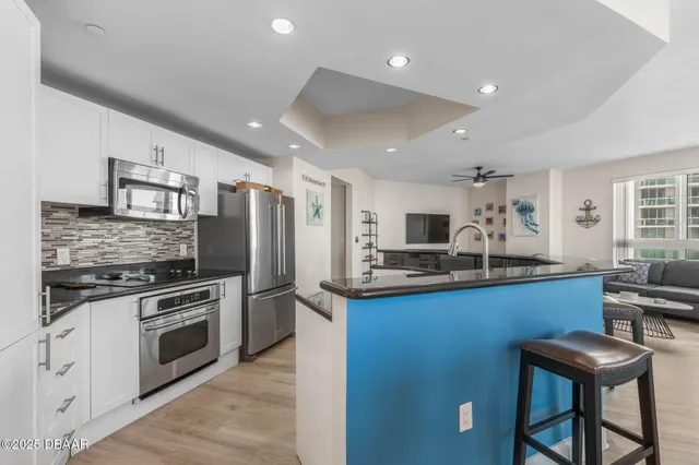 a row of palm trees and swimming pool in the backyard of a house