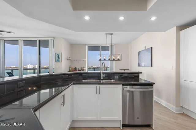 a view of swimming pool with outdoor seating and plants